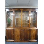 A good quality mahogany four door break front display cabinet,