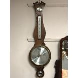 A mahogany cased barometer with silvered dial by Comitti