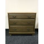 A 20th century painted pine three drawer chest