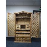 A Mexican pine cocktail cabinet with lattice doors