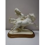 A Royal Worcester figure - galloping horses,