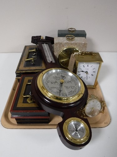 A tray containing two Cumbrian marble mantel clocks, brass carriage clock, two vintage cash boxes,