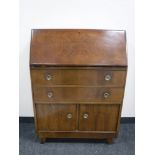 A mid twentieth century walnut bureau