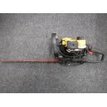 A Sabre HTS 53 petrol hedge trimmer and a Pro electric chain saw