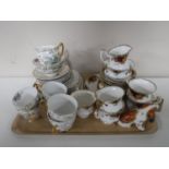 A tray containing a twenty one piece Royal Albert Old Country Roses tea set (one cup damaged)