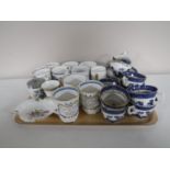 A tray of fifteen pieces of Booths Real Old Willow china, commemorative mugs, egg coddler,