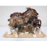 A tray containing four china shire horses