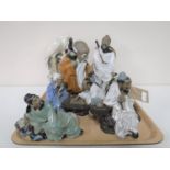 A tray containing eight Japanese pottery figures