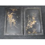 A pair of Japanese panels in relief decorated with birds