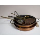 An antique brass and copper pan together with a copper sieve,