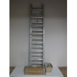 An aluminium four section ladder together with three boxes of anti climbing spikes,