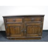 A Priory Oak double door cupboard