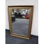 A gilt framed overmantel mirror