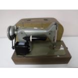 A mid 20th century Zephyr cased sewing machine