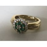 A 14ct gold emerald diamond ring, size M, 5.1g.