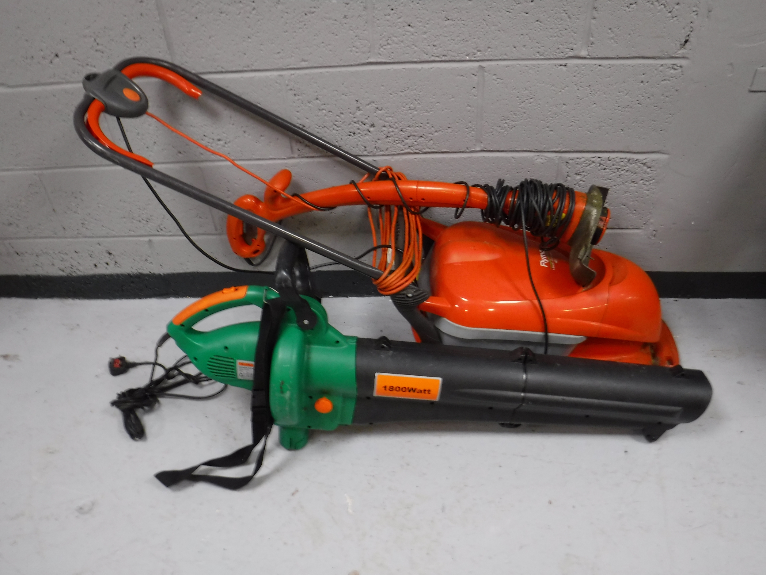 A Flymo electric strimmer and mower together with a garden vac and boxed hammock