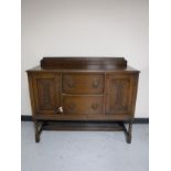 An early twentieth century sideboard on barley twist legs