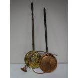 A copper and brass hunting horn and two bed warming pans.