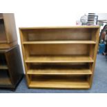 A set of walnut mid twentieth century bookshelves