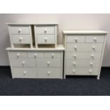 A contemporary four piece bedroom suite comprising of seven drawer chest,