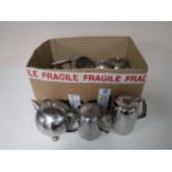 A box containing stainless steel tea services plated spirit kettle