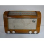 A mid 20th century walnut cased Philips valve radio.