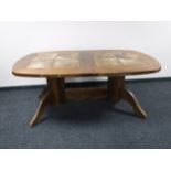 A continental oak tile topped dining table
