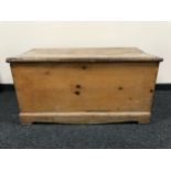 An antique pine blanket box