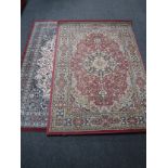 Two Persian design rugs on red ground