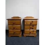 A pair of pine three drawer bedside chests