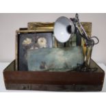 A vintage leather case containing an angle poised lamp,