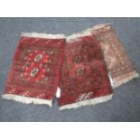 Three fringed Persian rugs