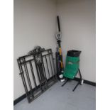 A pair of wrought iron gates, garden shredder,