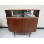 A mid twentieth century teak cocktail bar