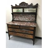 A Victorian mahogany and walnut marble topped washstand