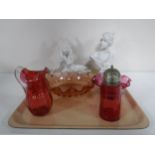 A tray of three pieces of cranberry glass ware, a bust,
