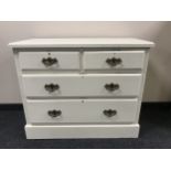 A painted Edwardian four drawer chest