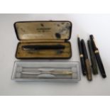 A collection of pens including examples with 14ct gold nibs