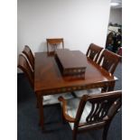 An eight piece reproduction Regency style dining room suite comprising of serpentine fronted