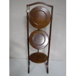 A Victorian mahogany folding cake stand