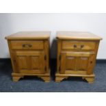 A pair of contemporary oak bedside chests