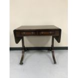 A mahogany sofa table fitted with two drawers