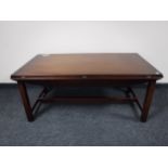 A mahogany flap sided coffee table