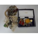 A box of compact, costume jewellery, Albert fob and watch key,