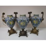 A trio of ormolu mounted blue and white decorative urns