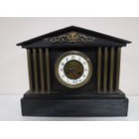 A Victorian slate mantel clock.