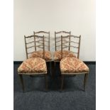 A set of four Victorian inlaid rosewood drawing room chairs