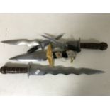 A replica dagger with eagle mounted hilt together with four other ornamental daggers