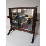 An antique mahogany toilet mirror