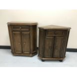 An oak double door cabinet with matching corner stand